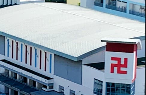 The sports hall of Red Swastika School in Bedok, with the school crest on its end wall